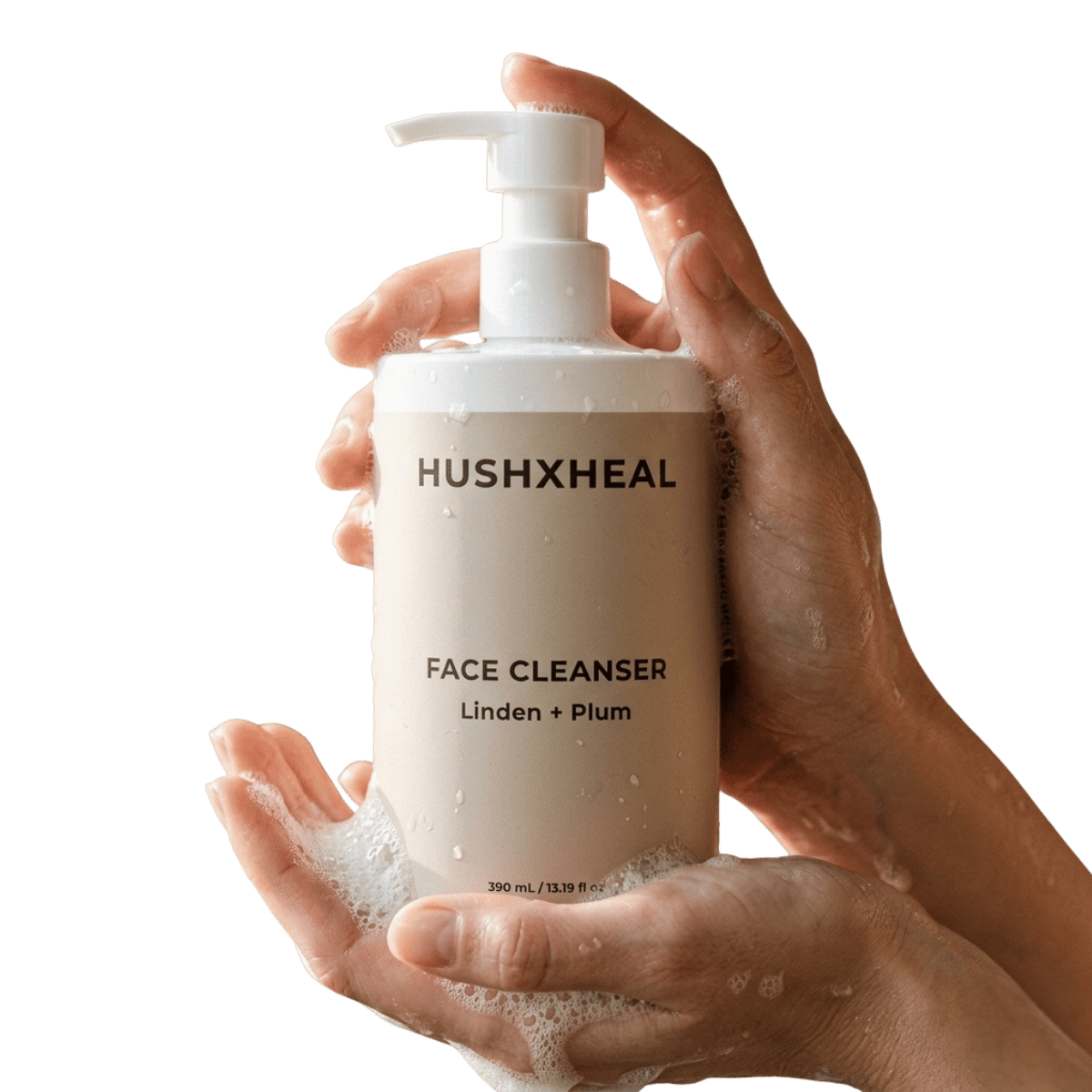 Two hands holding HUSHXHEAL Linden + Plum Face Cleanser 390 mL in a white pump bottle with a beige label, featuring water droplets and soft cleansing foam against a transparent background.